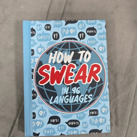 TOTE OF APPROXIMATELY 30 ASSORTED ITEMS TO INCLUDE: HOW TO SWEAR BOOK AND HOUSEHOLD MATCHES