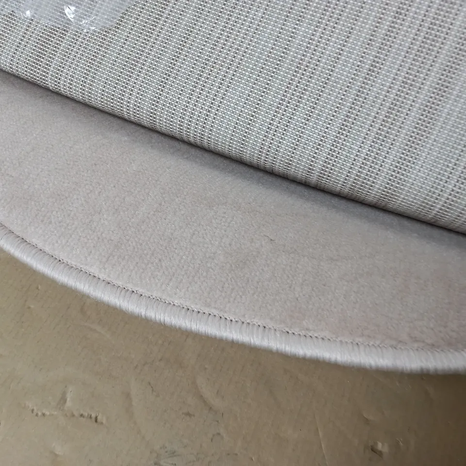 ROLLED CIRCULAR RUG IN NATURAL - SIZE UNSPECIFIED