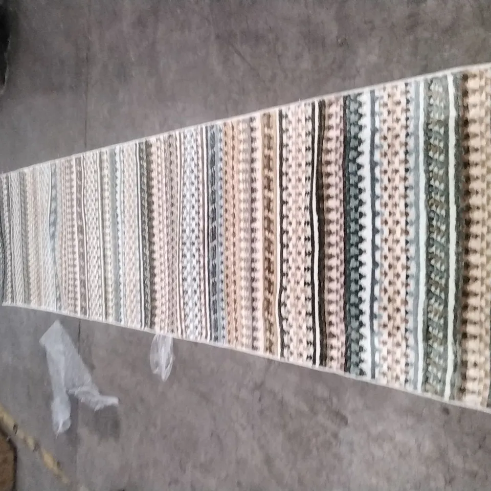 STILLAGE OF APPROXIMATELY 12 DESIGNER RUGS
