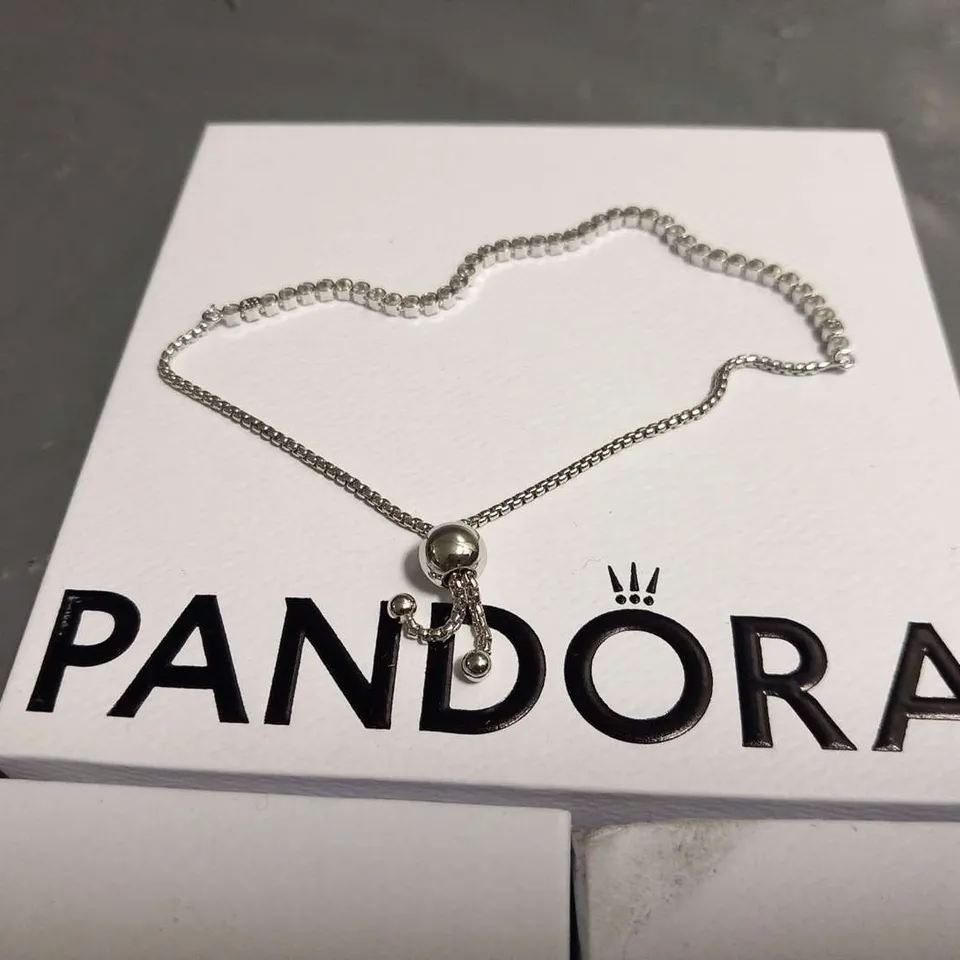 FOUR ASSORTED PANDORA PRODUCTS TO INCLUDE; BRACELTS AND CHARMS