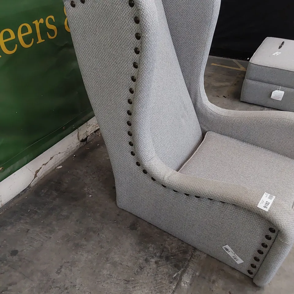 DESIGNER HIGH BACKED WINGED EASY CHAIR WITH STUDDED DETAIL 