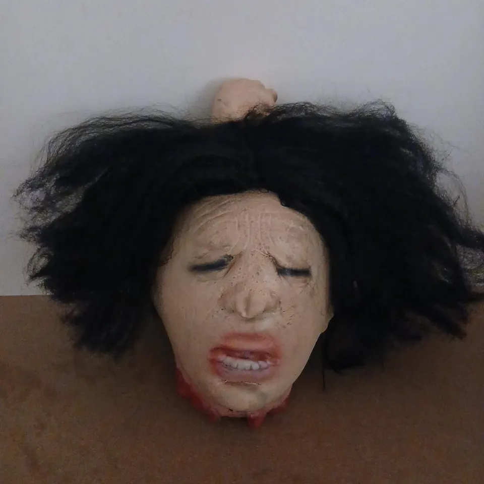 HEAD PROP WITH BLACK WIG – DISTRESSED FACIAL FEATURES