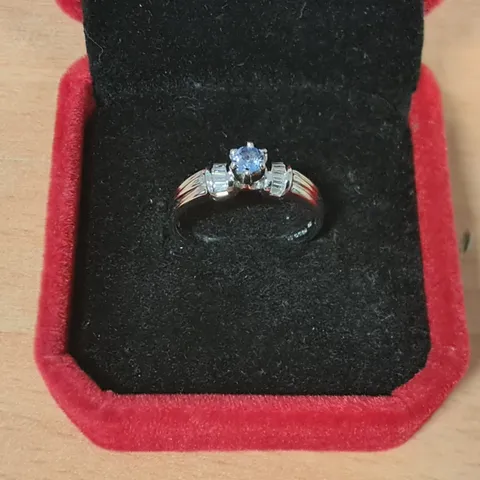 18CT WHITE GOLD RING SET WITH A TANZANITE AND NATURAL BAGUETTE CUT DIAMOND