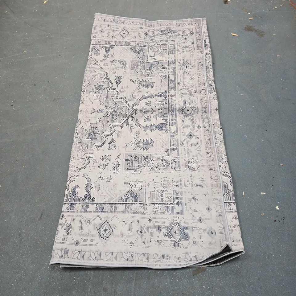 DECORATIVE AREA RUG, SIZE UNSPECIFIED. UNBOXED