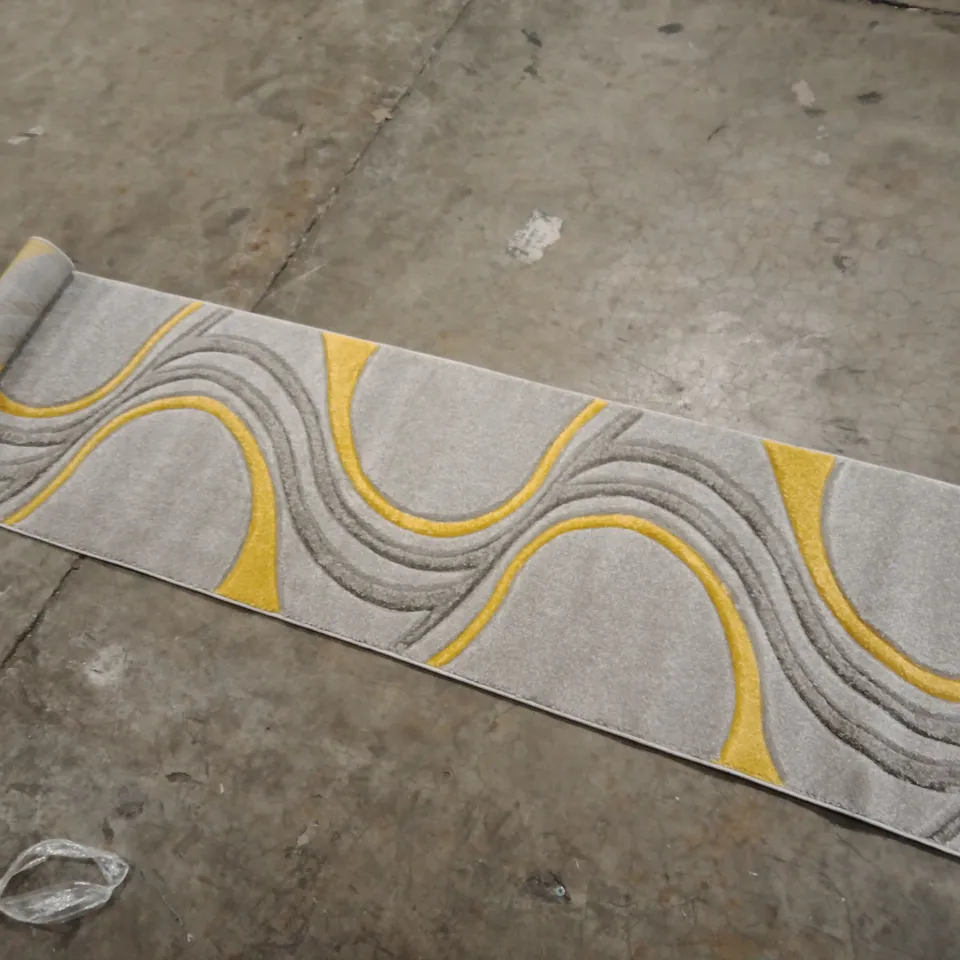 STILLAGE OF APPROXIMATELY 40 DESIGNER RUGS