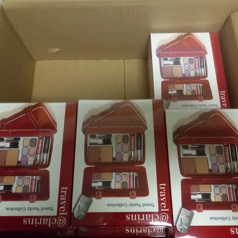 BOX OF APPROX 11 SEALED CLARINS TRAVEL VANITY COLLECTION 