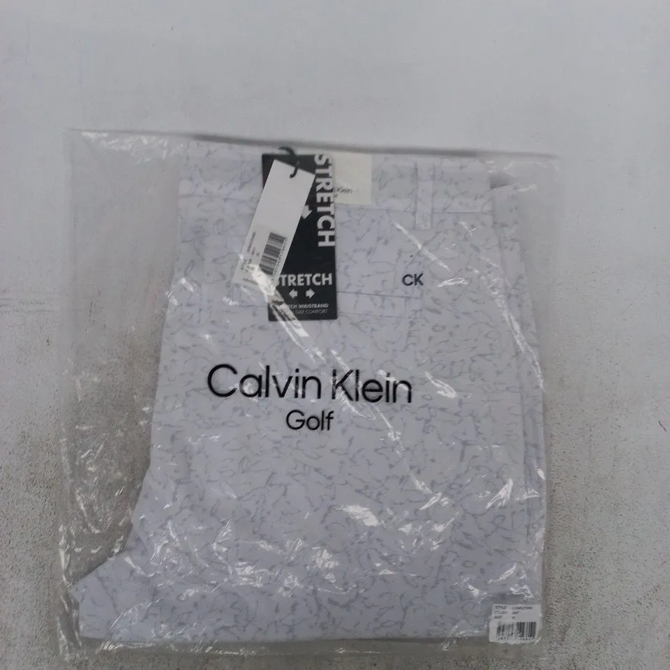 bagged calvin klein golf shorts in white size 38