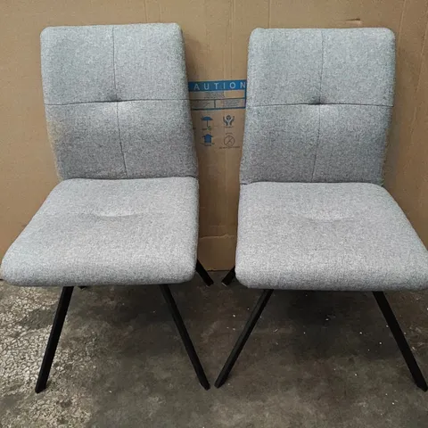 PAIR OF LIGHT GREY FABRIC ARMLESS DINING CHAIRS ON BLACK BASE