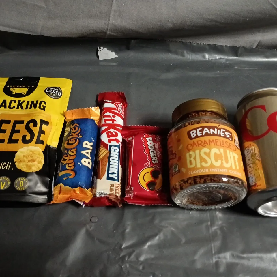 APPROXIMATELY 10 ASSORTED FOOD ITEMS TO INCLUDE -COCA COLA, CHEESE CRISPS AND ASSORTED CHOCOLATES