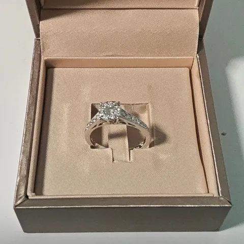 18CT WHITE GOLD RING SET WITH A NATURAL DIAMONDS AND WITH NATURAL DIAMOND SHOULDERS