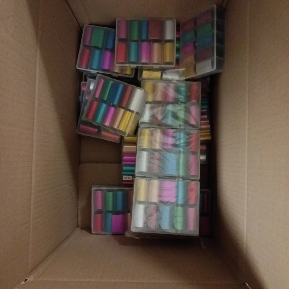 BOX OF APPROXIMATELY 25 ASSORTED NAIL FOIL ART