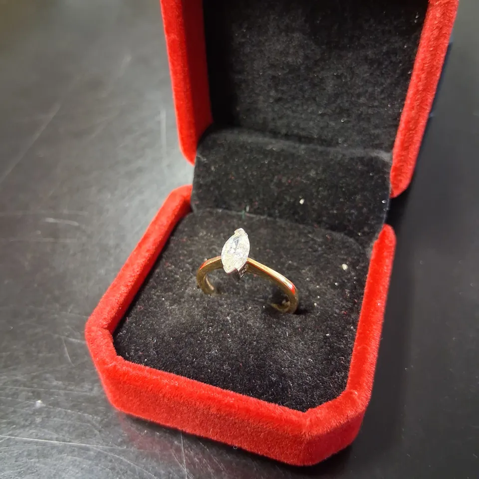 18CT GOLD SOLITAIRE RING SET WITH A NATURAL MARQUISE CUT DIAMOND 