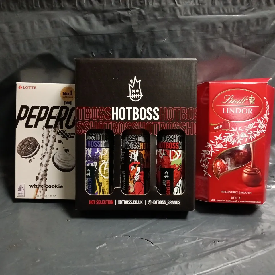 APPROXIMATELY 10 ASSORTED FOOD AND DRINK ITEMS TO INCLUDE LINDT, HOTBOSS, PEPERO, ETC