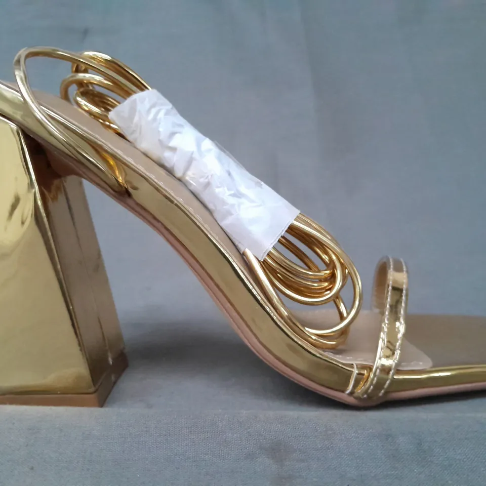 BOXED PAIR OF EGO OPEN TOE BLOCK HEEL SANDALS IN METALLIC GOLD UK SIZE 4