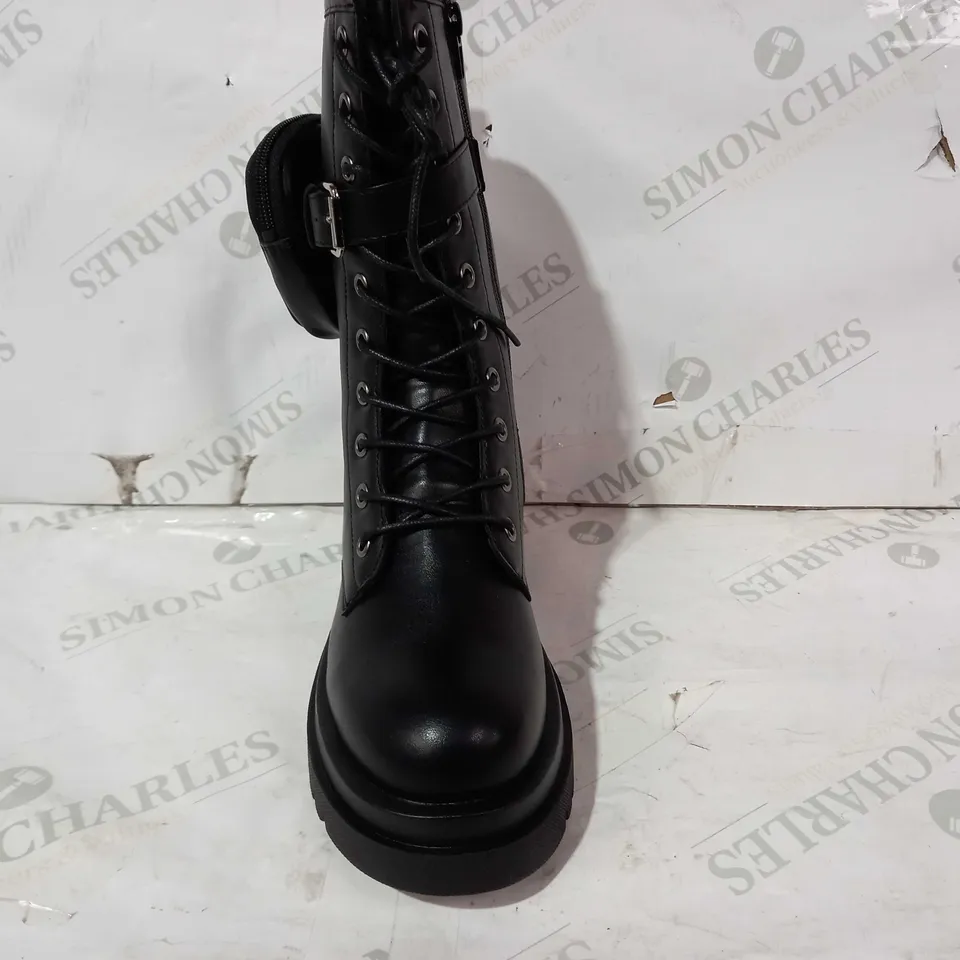 BOXED PAIR OF PRETTY LITTLE THING LEATHER BOOTS IN BLACK UK SIZE 4