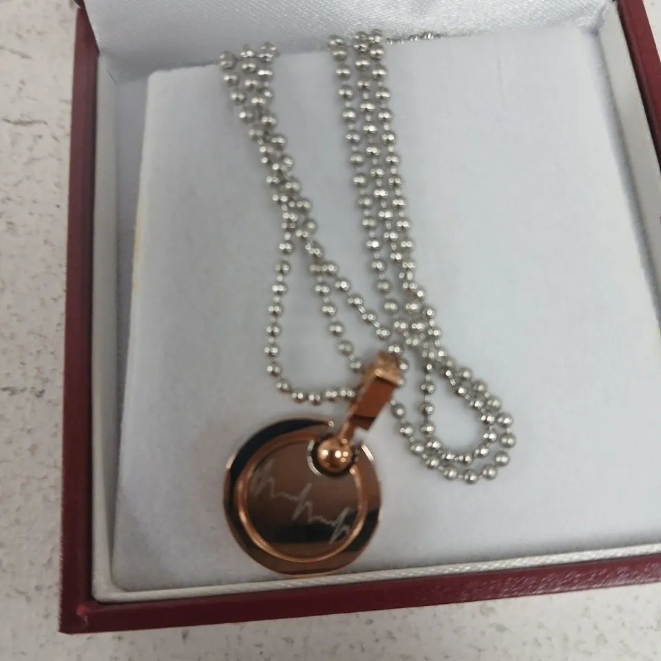 ROSE GOLD-TONE CIRCULAR PENDANT NECKLACE WITH ENAMEL HEARTBEAT MOTIF