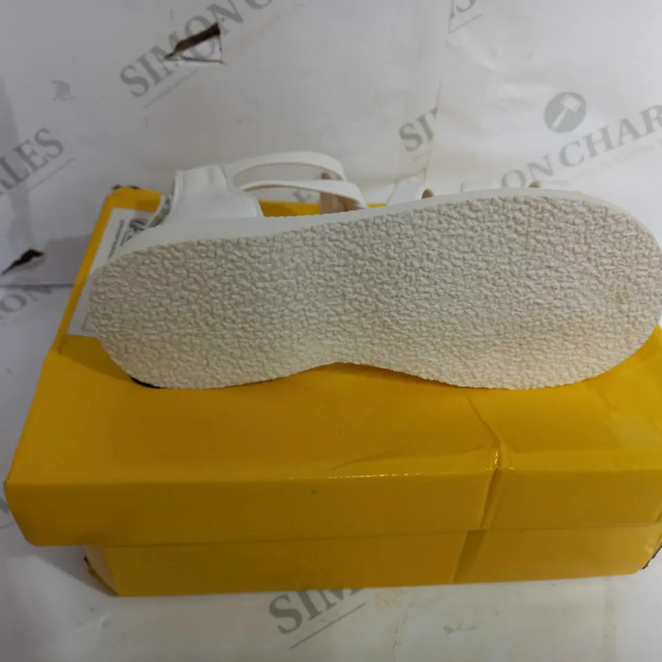 BOXED PAIR OF SANDALS WITH REAR ZIP, IN CREAM. SIZE UNSPECIFIED