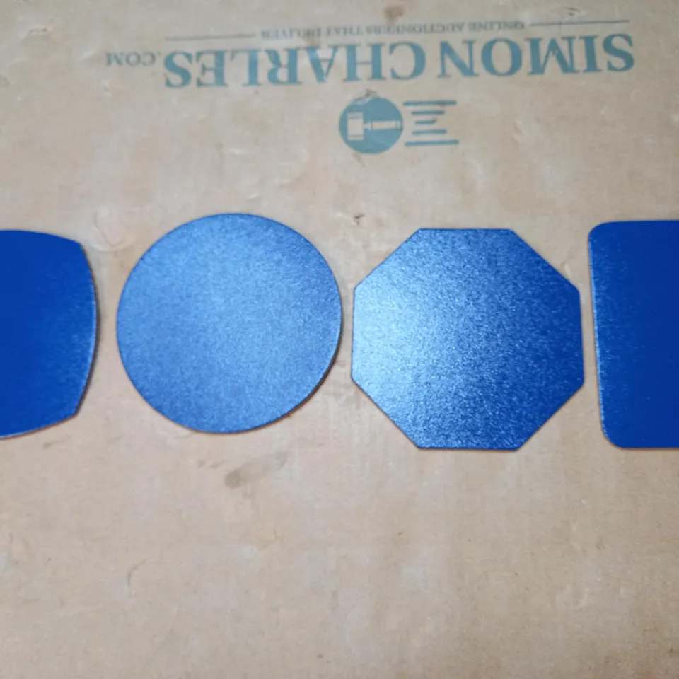 BOX OF APPROXIMATELY 300 CORK BACKED BLUE FLEXIBLE COASTERS IN ASSORTED SHAPES