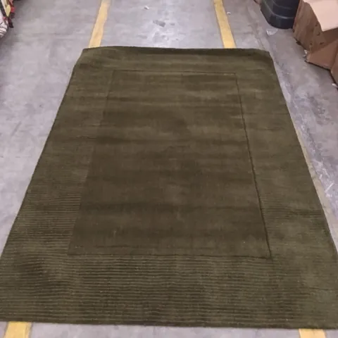 RECTANGULAR GREEN/BROWN RUG WITH DARKER BORDER APPROXIMATELY 230CM  X 160 CM