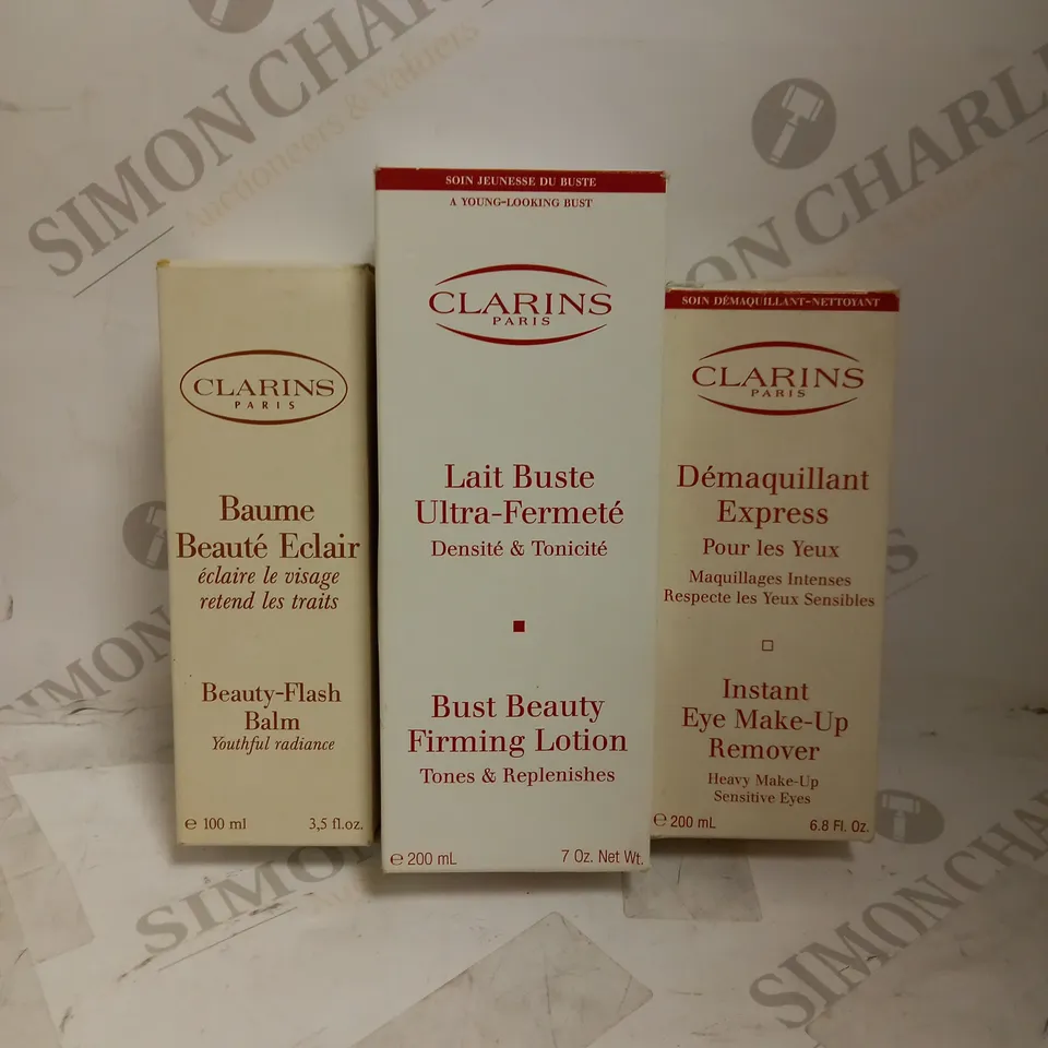 LOT OF 3 ASSORTED CLARINS PRODUCTS TO INCLUDE BEAUTY FLASH BALM 50ML, BUST BEAUTY FIRMING LOTION 200ML, EYE MAKUP REMOVER 200ML