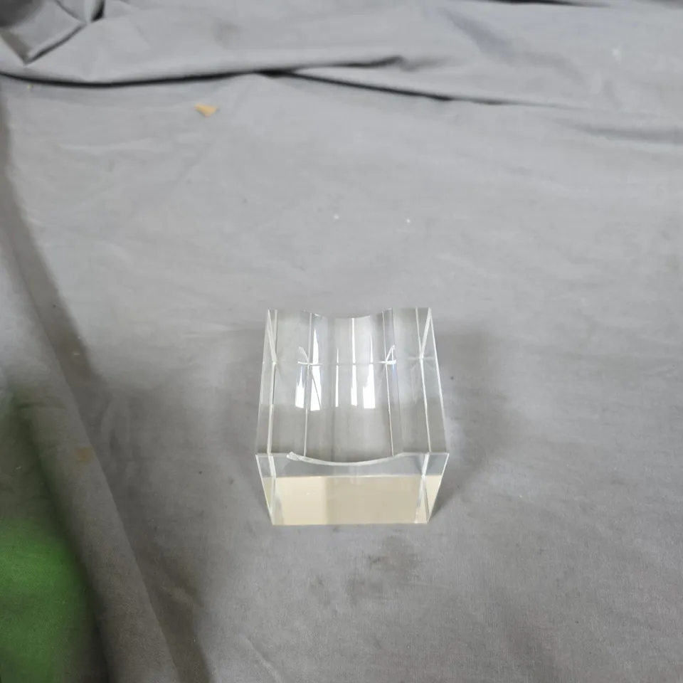 GREEN FACETED GLASS GEM SCULPTURE ON CLEAR ACRYLIC BASE