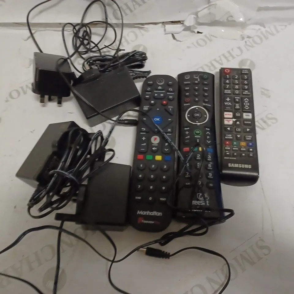 BOX OF ASSORTED ELECTRICALS INCLUDING 3 FREEVIEW REMOTES, SWITCHING ADAPTERS