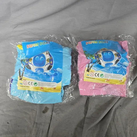 APPROXIMATELY 70 ASSORTED SWIM BOAT CHILDRENS INFLATABLE RINGS IN BLUE & PINK - COLLECTION ONLY