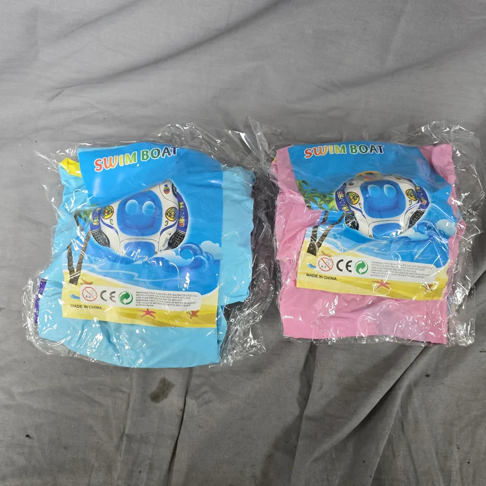 APPROXIMATELY 70 ASSORTED SWIM BOAT CHILDRENS INFLATABLE RINGS IN BLUE & PINK - COLLECTION ONLY