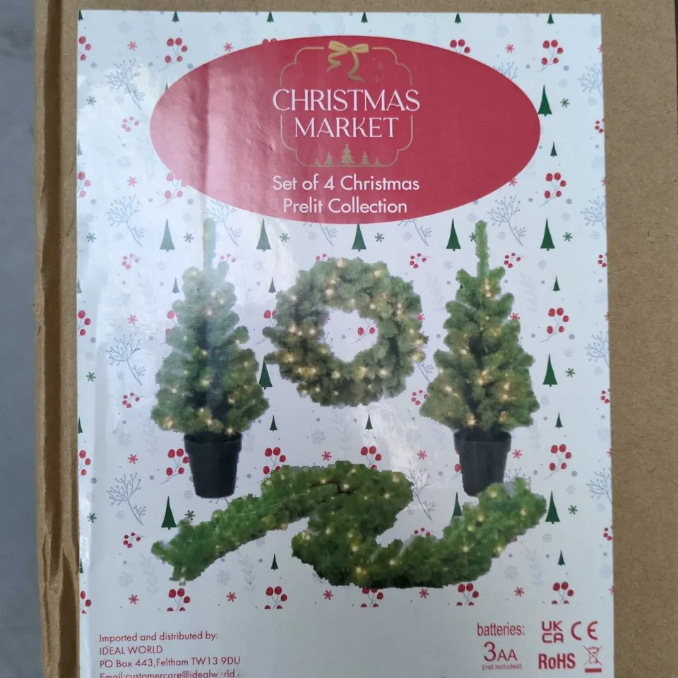 CHRISTMAS MARKET SET OF 4 PRE-LIT CHRISTMAS TREES – BOXED WITH GARLAND (BATTERY-POWERED, NOT INCLUDED)