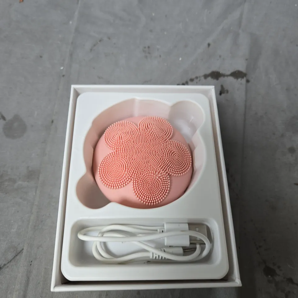 BEAUTECH SILICONE MASSAGE BRUSH – PINK CIRCULAR DEVICE WITH TEXTURED FLORAL SURFACE, USB CHARGING CABLE