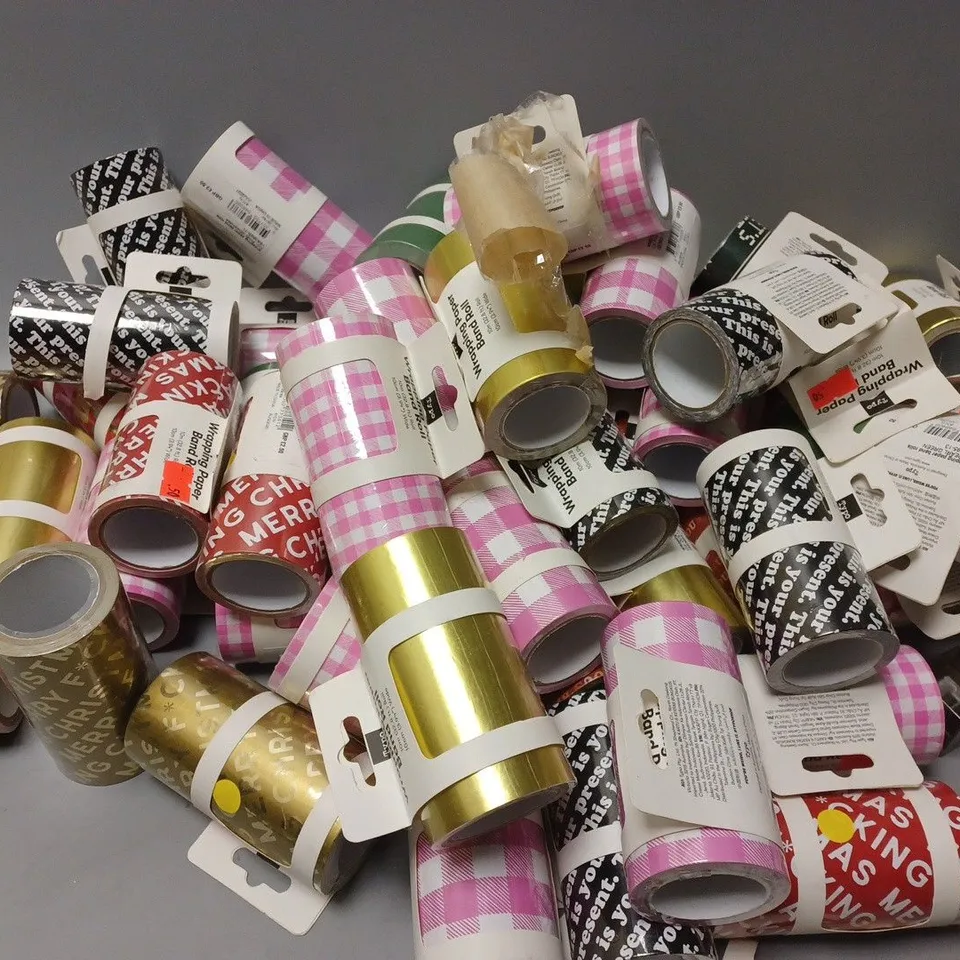 APPROXIMATELY 50 ASSORTED TYPO WRAPPING PAPER ROLLS - 10M ROLL, 10CM WIDE