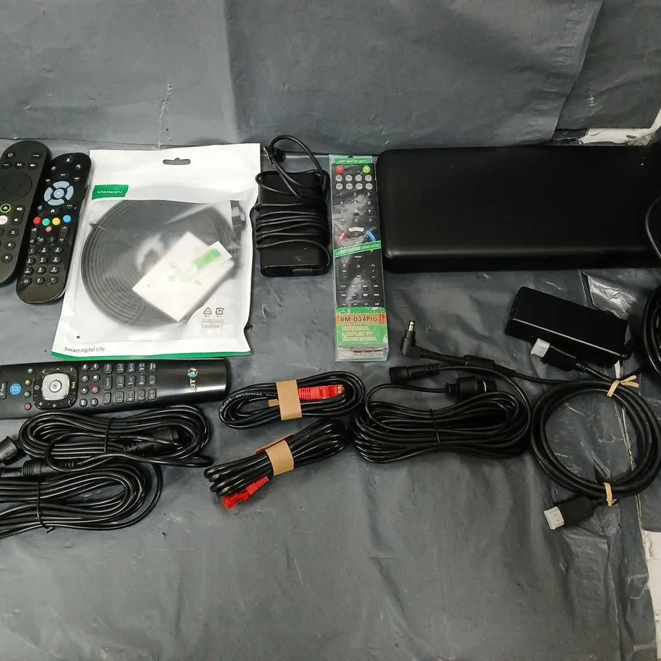 APPROXIMATELY 12 ASSORTED ITEMS TO INCLUDE - WIRES, REMOTES, AND CHARGERS ETC. 