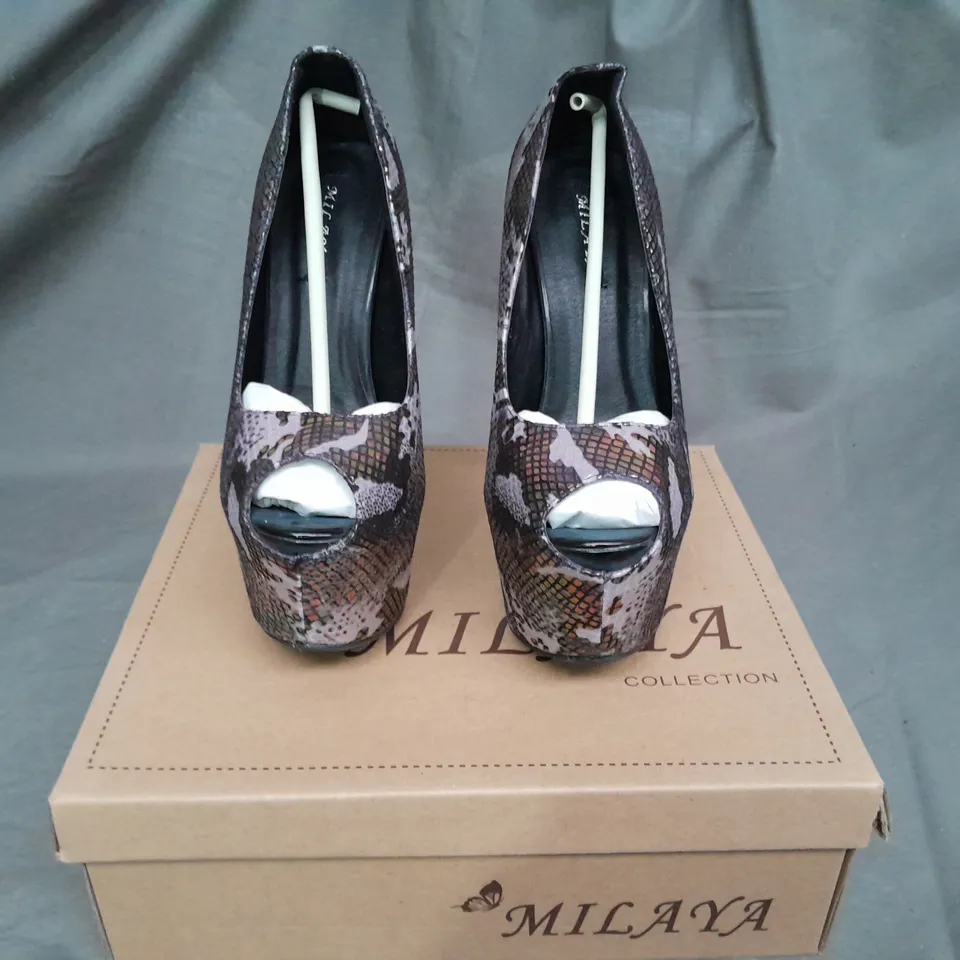 APPROXIMATELY 10 BOXED PAIRS OF PLATFORM HEALS VARIOUS SIZES 