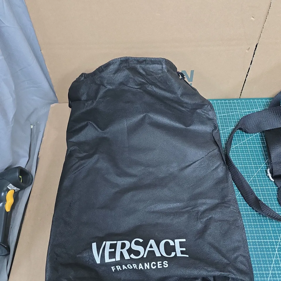 VERSACE FRAGRANCES BLACK DUFFEL BAG WITH GREEK KEY STRAP AND PINK LINING