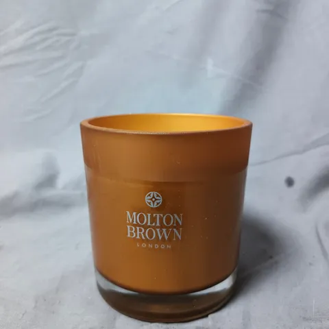 MOLTON BROWN LONDON CANDLE IN AMBER GLASS CONTAINER