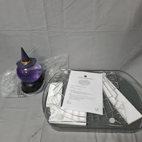 CAGE OF APPROXIMATELY 10 ASSORTED HOUSEHOLD ITEMS TO INCLUDE - KITCHENWARE - WITCH GARDEN WATER SPRINKLER - ETC. - COLLECTION ONLY  