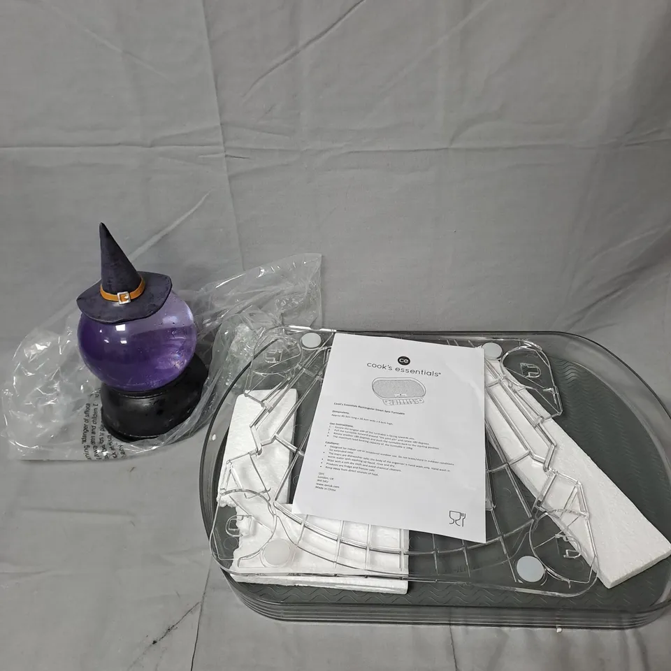 CAGE OF APPROXIMATELY 10 ASSORTED HOUSEHOLD ITEMS TO INCLUDE - KITCHENWARE - WITCH GARDEN WATER SPRINKLER - ETC. - COLLECTION ONLY  