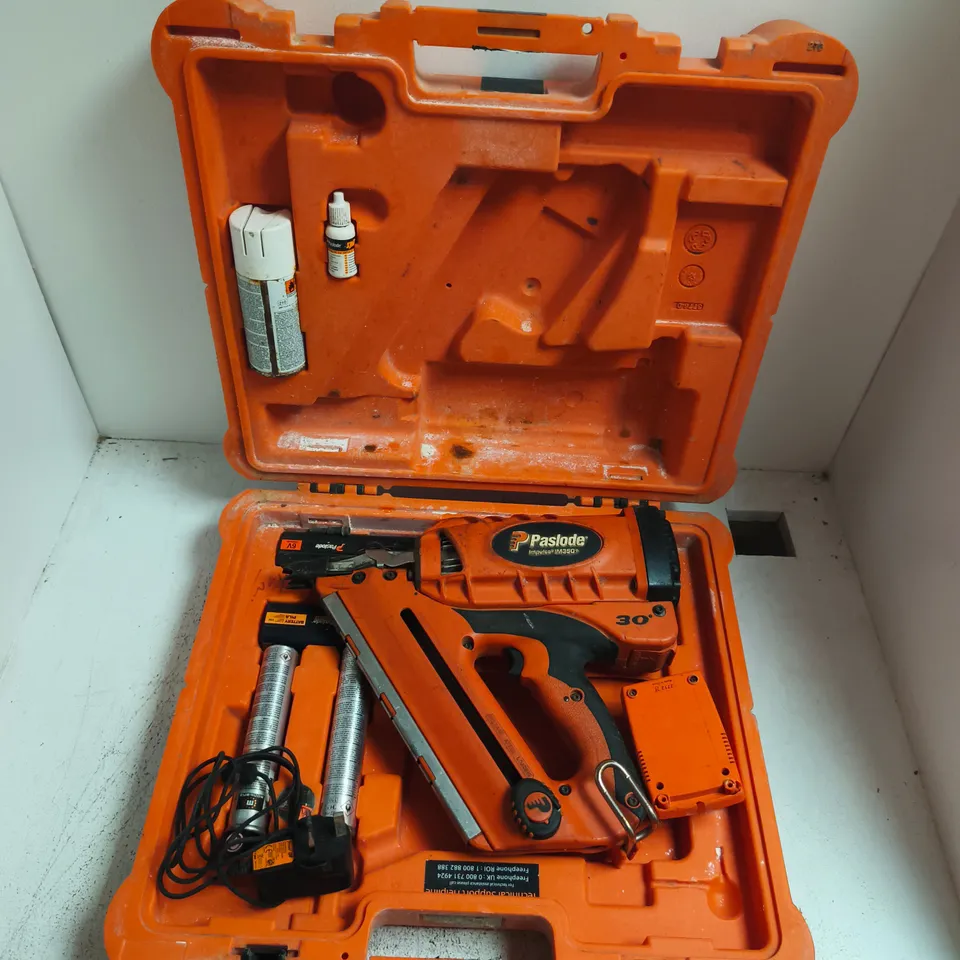 PASLODE CORDLESS NAIL GUN IN ORANGE CASE – WITH GAS CANISTERS
