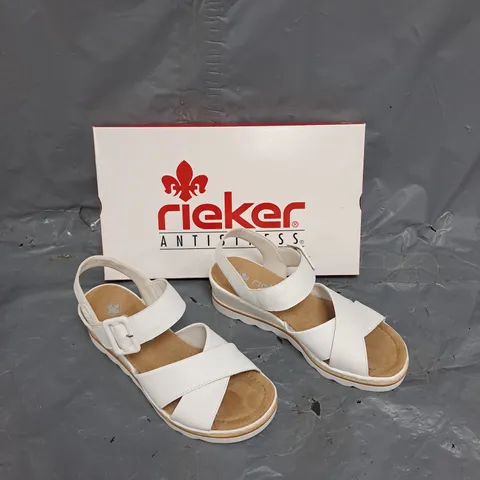 BOXED PAIR OF RIEKER WHITE ANKLE STRAP SANDAL SIZE 39