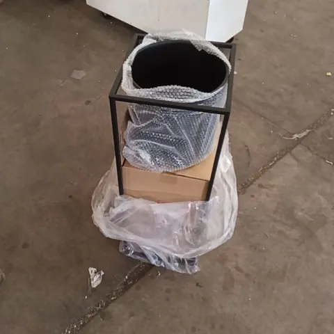 Garden planter on metal stand, wrapped in bubble wrap