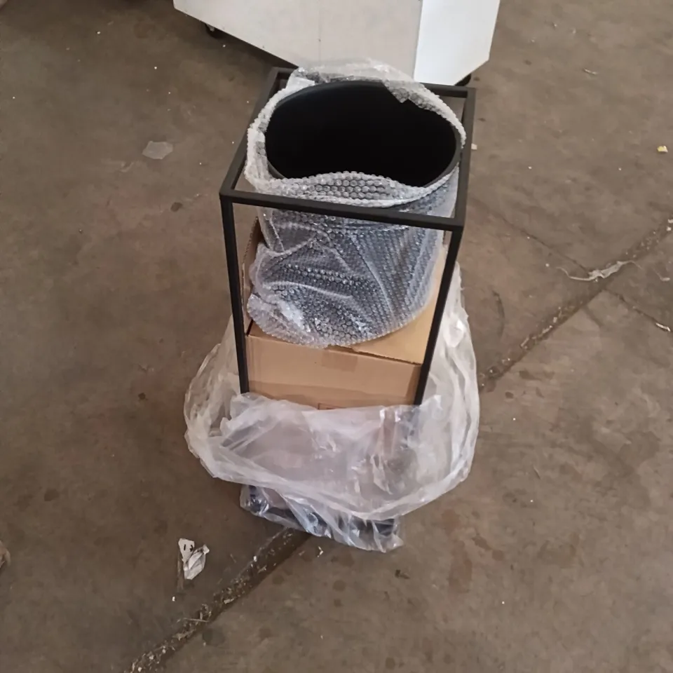 Garden planter on metal stand, wrapped in bubble wrap