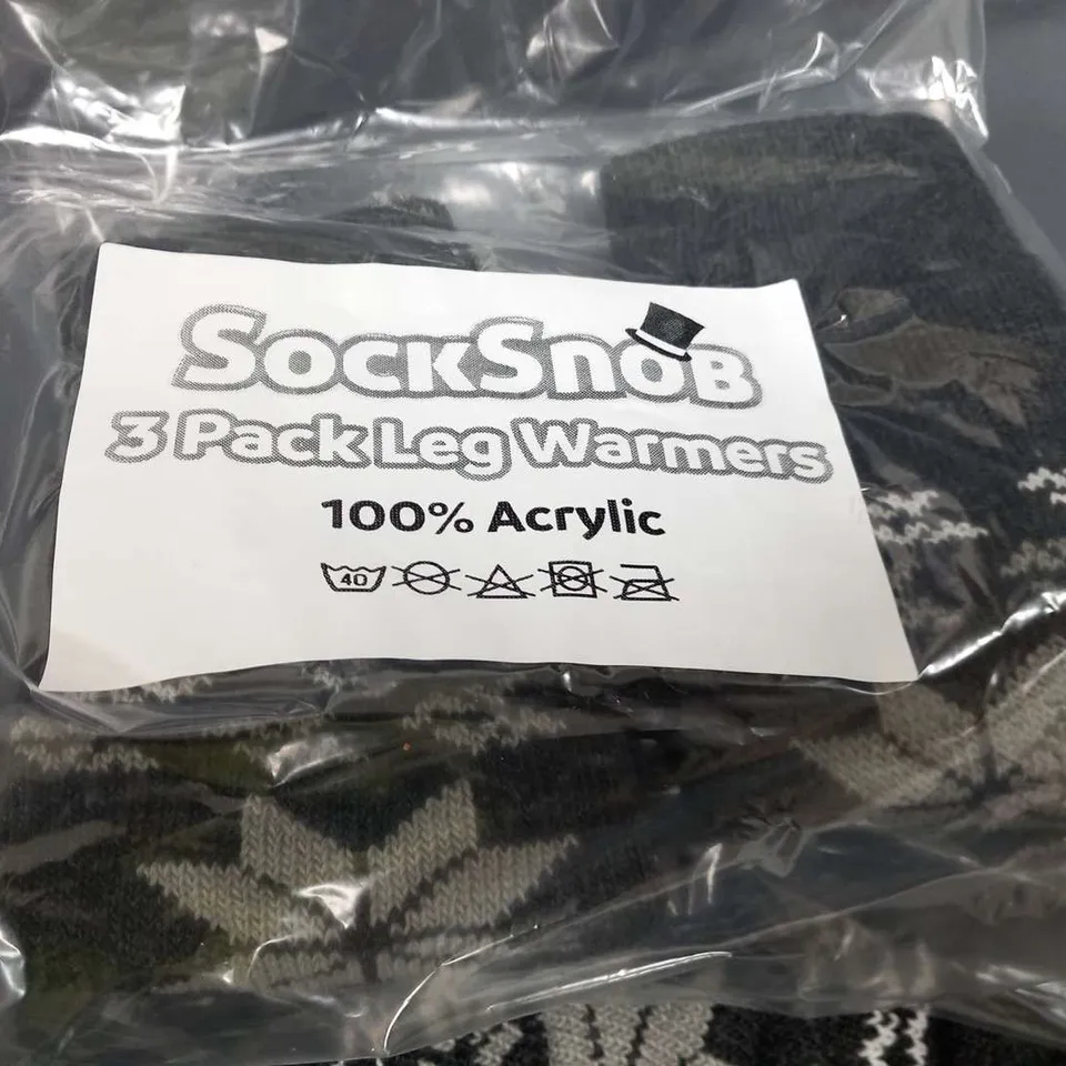 APPROXIMATELY 30 PACKS OF THREE SOCK SNOB 100% ACRYLIC LEG WARMERS BLACK