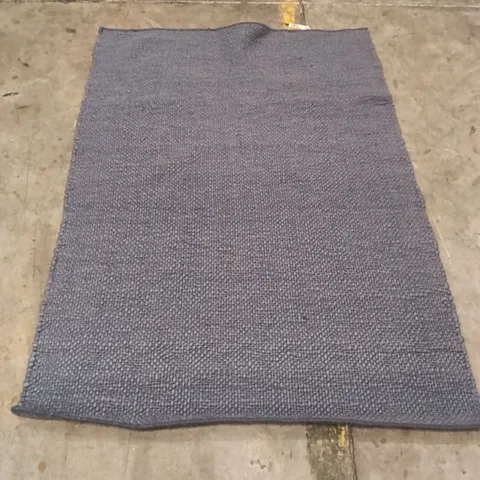 STILLAGE CONTAINING DESIGNER AREA RUGS APPROXIMATELY 15 RUGS 
