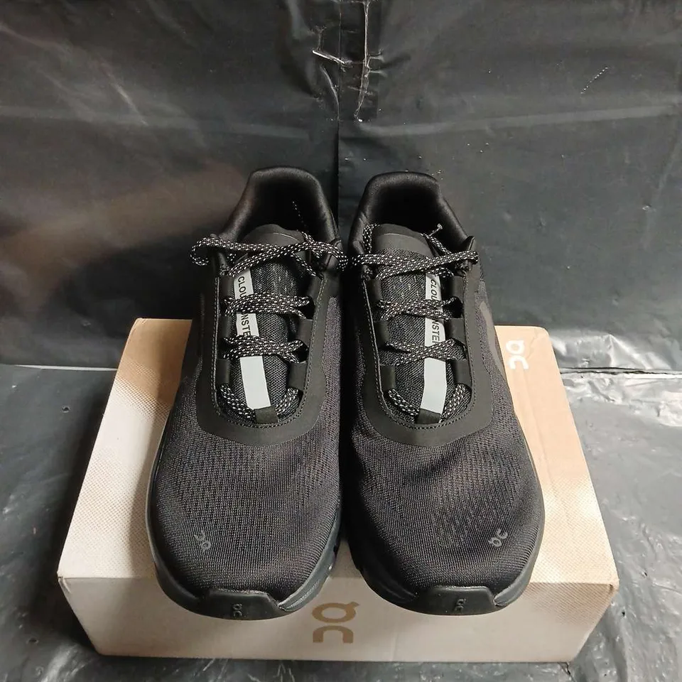 BOXED PAIR OF ON RUNNING CLOUDMONSTER TRAINERS – BLACK/SILVER, UK 10.5 (US 11)