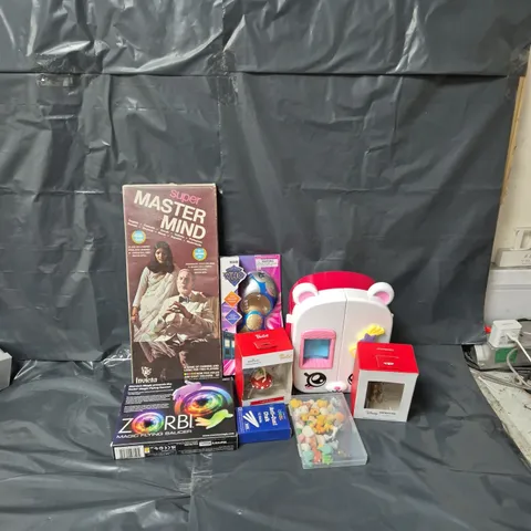 APPROXIMATELY 12 ASSORTED TOYS & GAMES TO INCLUDE INVICTA MASTERMIND GAME, DOCTOR WHO 15TH DR SCREWDRIVER, DISNEY CHEWBACCA CHRISTMAS TREE ONRNAMENT, ETC