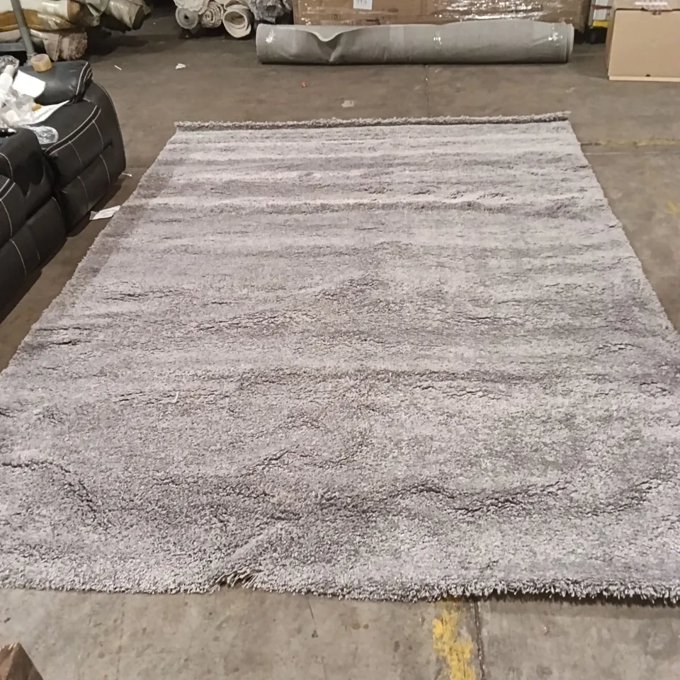 STILLAGE OF DESIGNER RUGS APPROXIMATELY 15 LARGE RUGS