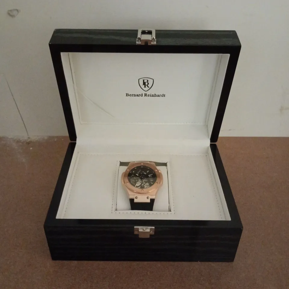 BERNARD REINHARDT ROSE GOLD SKELETON DIAL WRISTWATCH – BOXED 