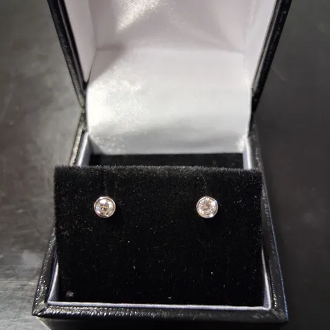 18CT WHITE GOLD STUD EARRINGS RUB-OVER SET WITH NATURAL DIAMONDS