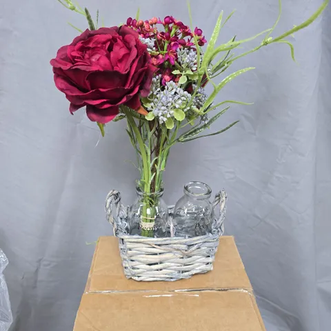 Peony decorative artificial floral arrangement in wicker basket with glass bottles