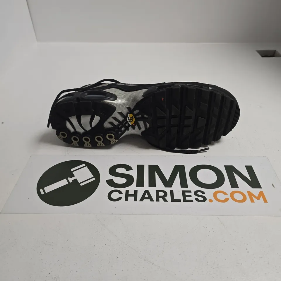 UNBOXED PAIR OF NIKE AIR MAX PLUS TN SNEAKERS IN A BLACK AND REFLECTIVE SILVER COLORWAY - UK 11.5